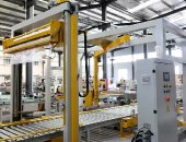 通过式覆顶膜机+摇臂缠绕机